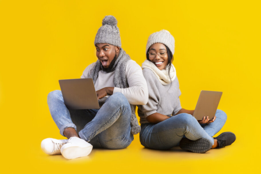 pennsylvania online lottery, man and woman on computers playing online lottery