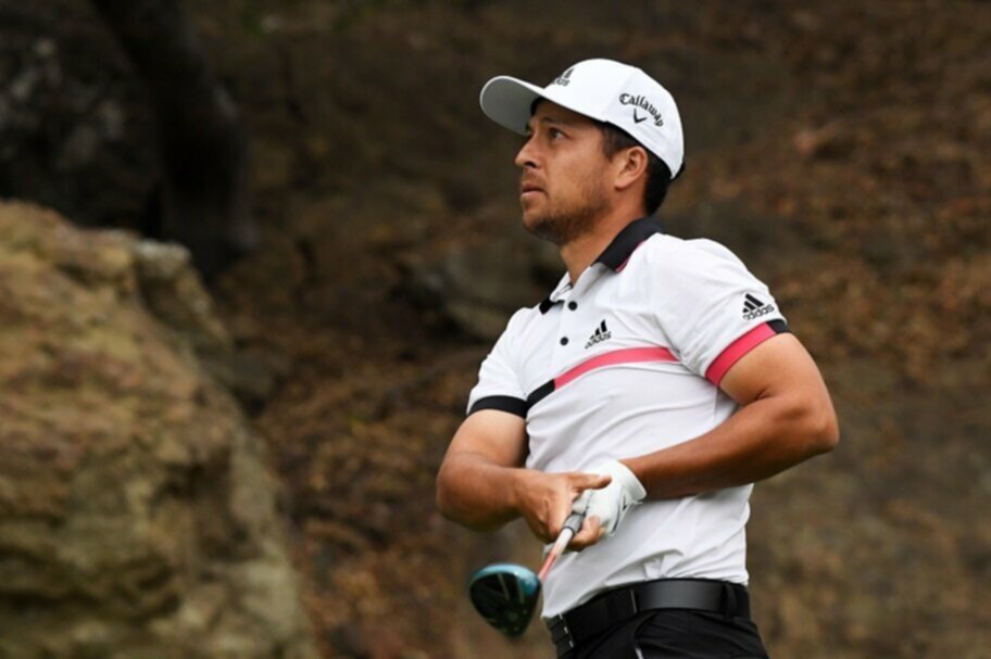 Xander Schauffele watches his shot