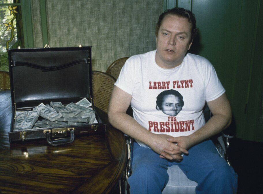 larry flynt with suitcase of cash and larry for president shirt