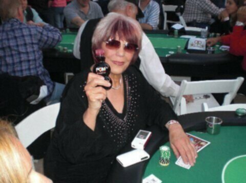 barbara enright playing poker, holding a bottle of juice