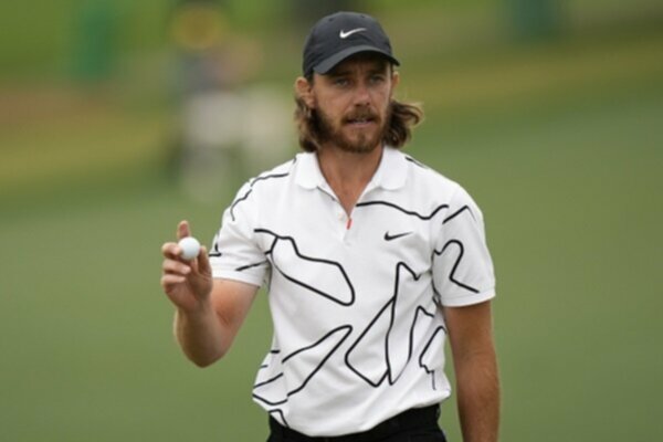 Tommy Fleetwood walks away with his ball