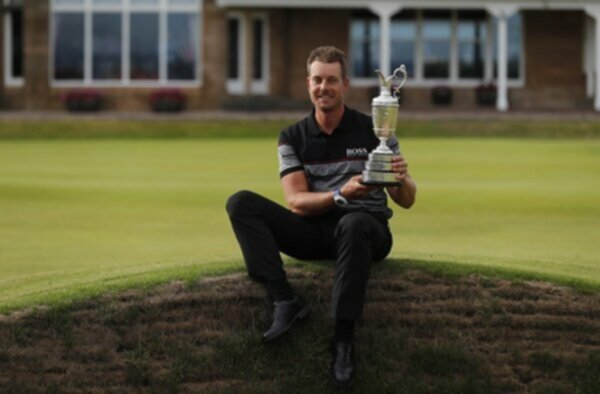 Henrik Stenson poses with the Claret Jug