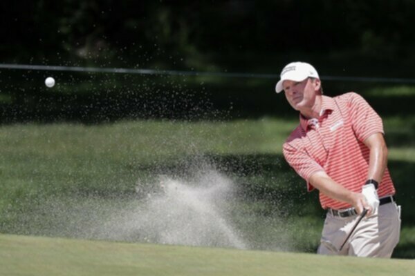 Steve Stricker hits a bunker shot