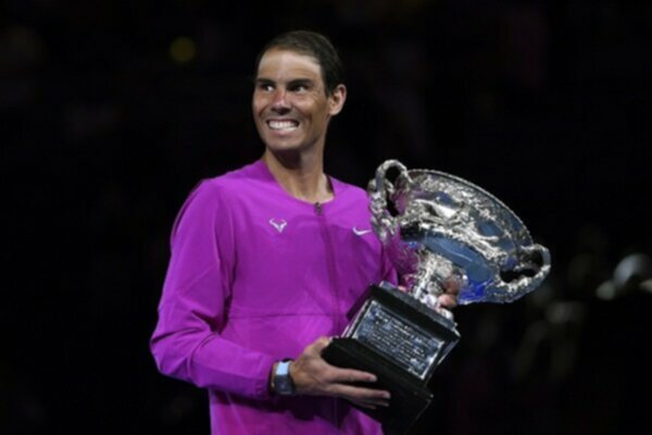 Rafael Nadal celebrates with Australian Open trophy