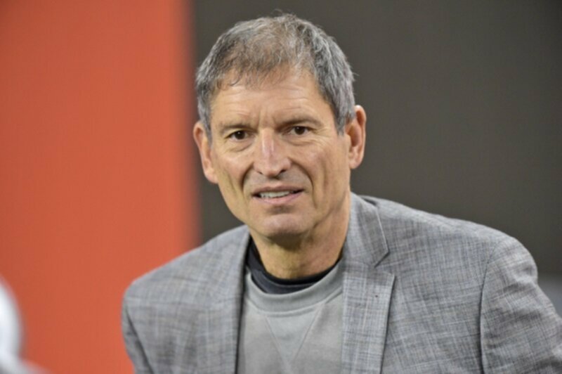 Bernie Kosar looks on at a football game